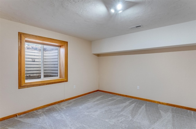 46452 Stagecoach Trl, Ronan, MT 59864 - carpeted empty room featuring baseboards and a textured ceiling