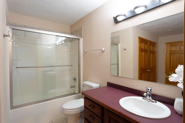 46452 Stagecoach Trl, Ronan, MT 59864 - full bathroom featuring vanity, bath / shower combo with glass door, a textured ceiling, and a textured wall