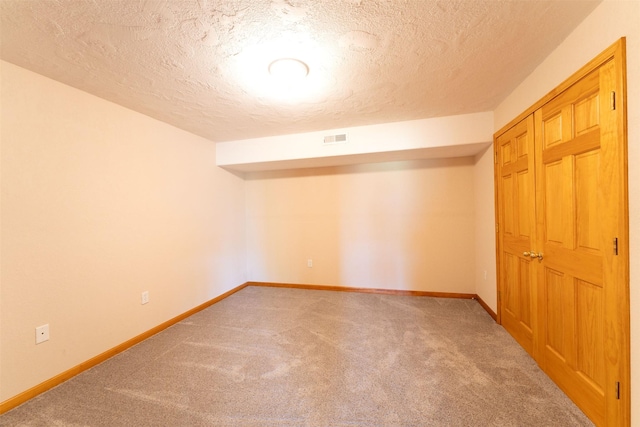46452 Stagecoach Trl, Ronan, MT 59864 - unfurnished bedroom featuring carpet and a textured ceiling