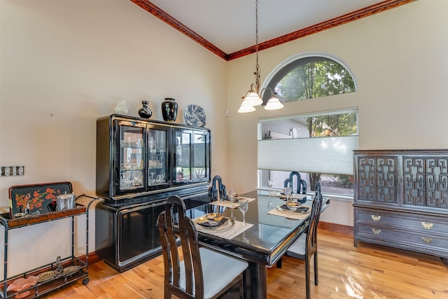 46452 Stagecoach Trl, Ronan, MT 59864 - dining space featuring ornamental molding, a chandelier, and wood finished floors