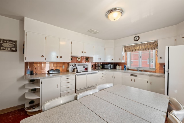 209 Spruce St, Anaconda, MT 59711 - kitchen with white appliances, backsplash, white cabinets, light countertops, and open shelves