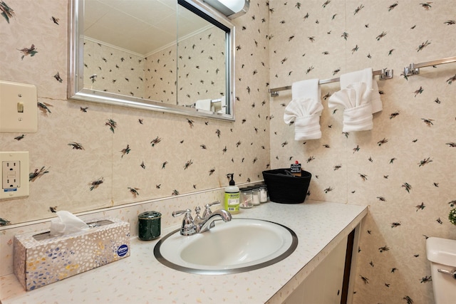 209 Spruce St, Anaconda, MT 59711 - bathroom featuring vanity, ornamental molding, and wallpapered walls