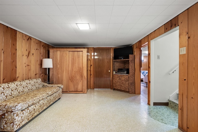 209 Spruce St, Anaconda, MT 59711 - living room featuring wooden walls and stairway