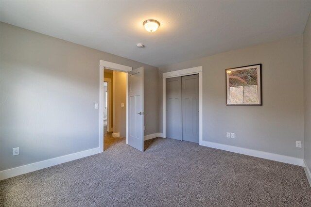 605-607 Leslie Ave, Helena, MT 59601 - unfurnished bedroom featuring carpet and a closet