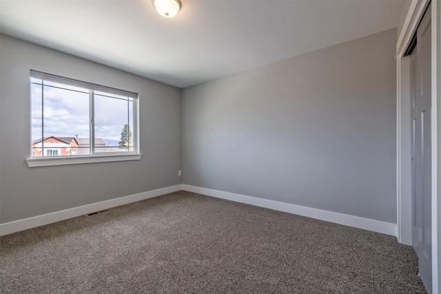 605-607 Leslie Ave, Helena, MT 59601 - unfurnished room featuring carpet flooring