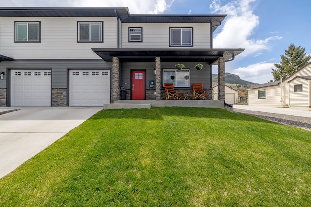 605-607 Leslie Ave, Helena, MT 59601 - view of front of house with stone siding, a porch, a front lawn, driveway, and an attached garage