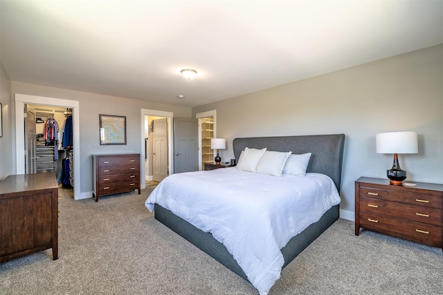 605-607 Leslie Ave, Helena, MT 59601 - bedroom with light colored carpet, a spacious closet, and a closet