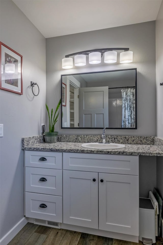 605-607 Leslie Ave, Helena, MT 59601 - full bath with wood finished floors and vanity