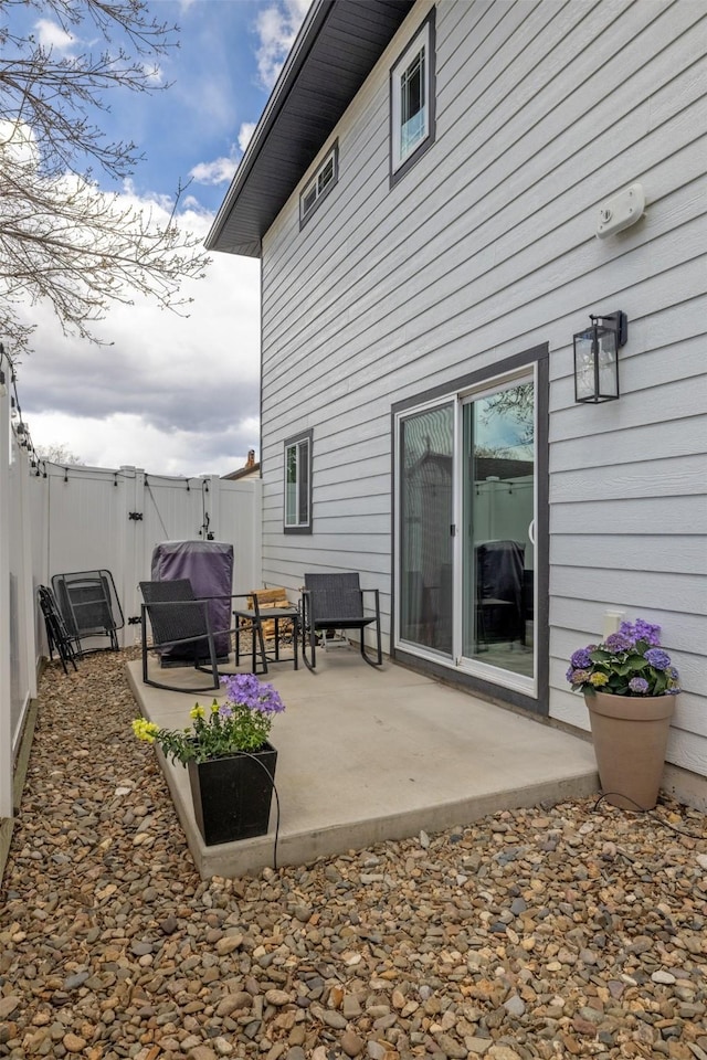 605-607 Leslie Ave, Helena, MT 59601 - rear view of house featuring a gate, a patio area, and a fenced backyard