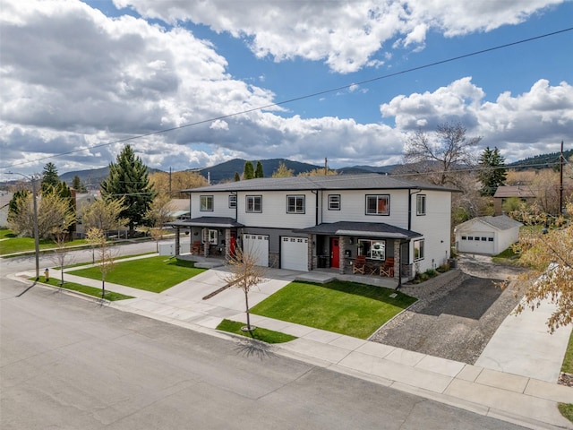 605-607 Leslie Ave, Helena, MT 59601 - view of property with a porch, driveway, a front yard, a mountain view, and an attached garage