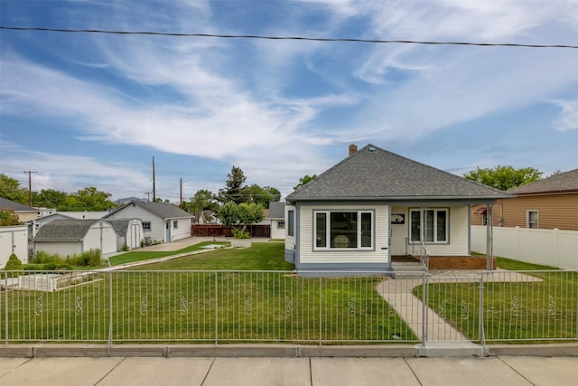 1414 Boulder Ave, Helena, MT 59601 - bungalow-style house featuring a fenced front yard, a shingled roof, and covered porch