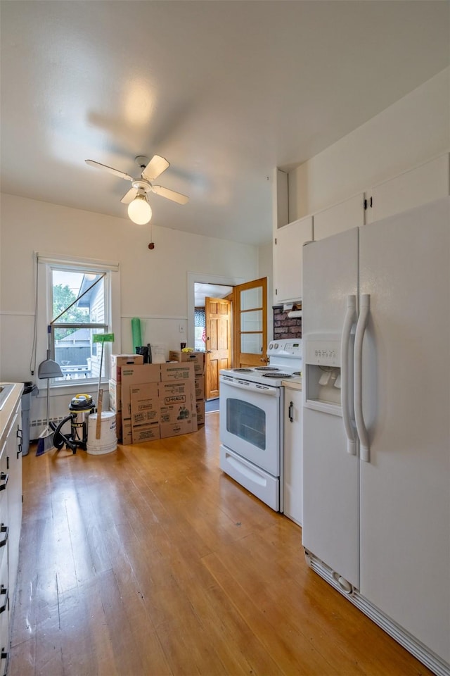 1414 Boulder Ave, Helena, MT 59601 - kitchen featuring white appliances, white cabinetry, light wood-style floors, ceiling fan, and light countertops