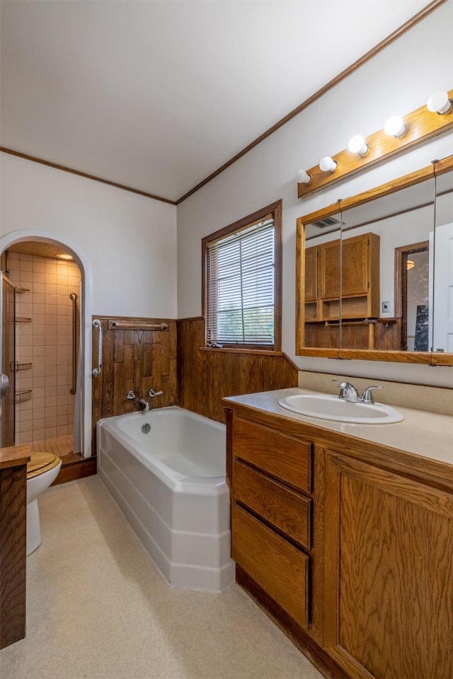 1414 Boulder Ave, Helena, MT 59601 - full bathroom with vanity, a bath, a shower stall, a wainscoted wall, and ornamental molding