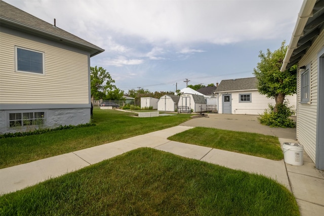 1414 Boulder Ave, Helena, MT 59601 - view of green lawn with a storage shed and a patio area