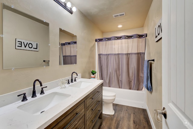 2871 Alexis Ave, Helena, MT 59601 - full bath with double vanity, wood finished floors, and shower / tub combo