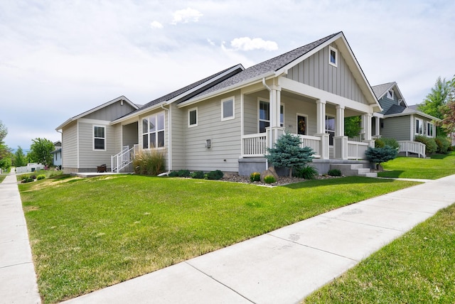 2871 Alexis Ave, Helena, MT 59601 - view of front of property featuring board and batten siding, a porch, and a front lawn