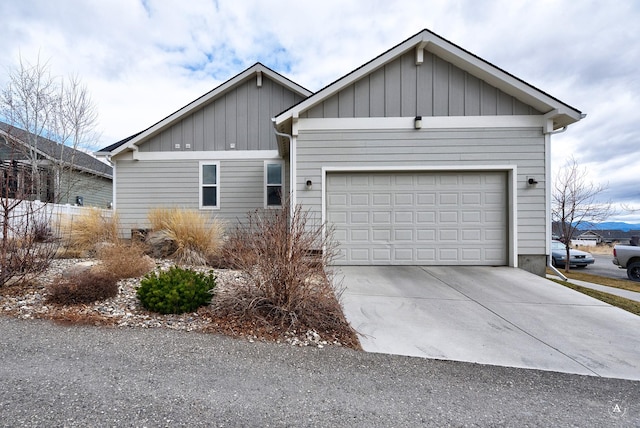 2871 Alexis Ave, Helena, MT 59601 - ranch-style house featuring board and batten siding, an attached garage, and driveway