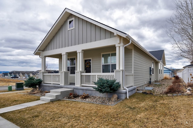 2871 Alexis Ave, Helena, MT 59601 - view of front of property featuring a porch, board and batten siding, and a front yard