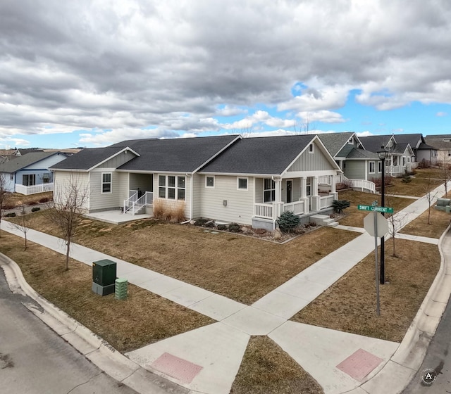 2871 Alexis Ave, Helena, MT 59601 - single story home featuring covered porch, a residential view, a shingled roof, and board and batten siding