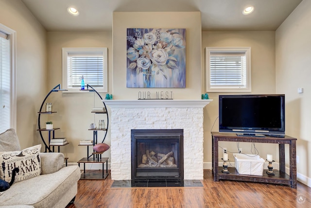 2871 Alexis Ave, Helena, MT 59601 - living area with a stone fireplace, plenty of natural light, wood finished floors, and recessed lighting