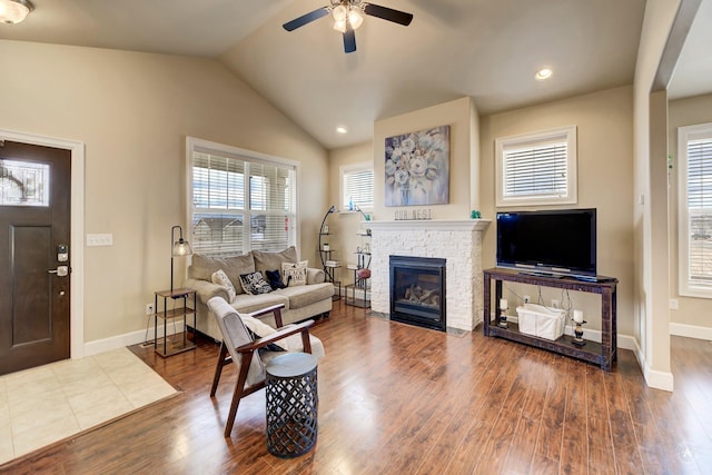 2871 Alexis Ave, Helena, MT 59601 - living room featuring ceiling fan, wood finished floors, a fireplace, vaulted ceiling, and recessed lighting