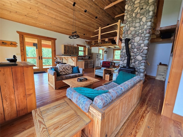 670GUSCREEK Gus Creek Rd, Yaak, MT 59935 - living area featuring a wood stove, wooden ceiling, french doors, vaulted ceiling, and wood finished floors