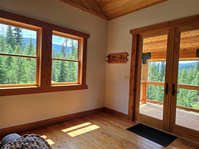 670GUSCREEK Gus Creek Rd, Yaak, MT 59935 - doorway to outside with vaulted ceiling, light wood finished floors, french doors, and wood ceiling