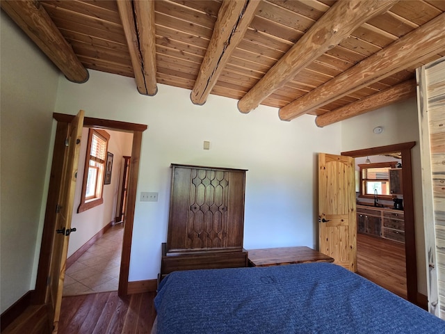 670GUSCREEK Gus Creek Rd, Yaak, MT 59935 - bedroom with a wooden ceiling with exposed beams, multiple windows, and wood finished floors