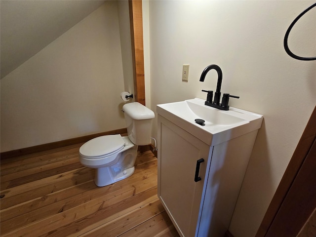 670GUSCREEK Gus Creek Rd, Yaak, MT 59935 - bathroom featuring vanity, hardwood / wood-style flooring, and lofted ceiling