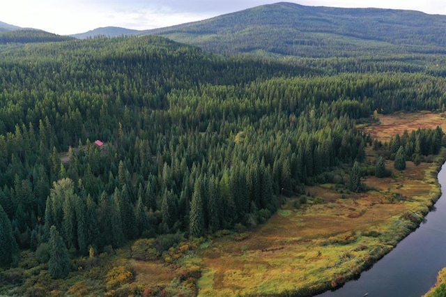670GUSCREEK Gus Creek Rd, Yaak, MT 59935 - view of mountain backdrop featuring a heavily wooded area