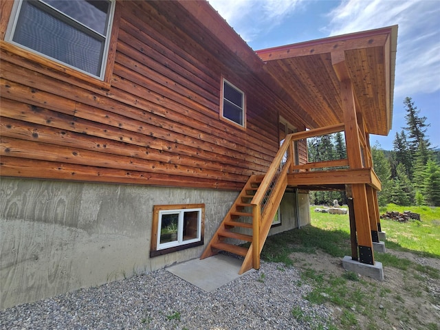 670GUSCREEK Gus Creek Rd, Yaak, MT 59935 - view of property exterior with stairway and a wooden deck