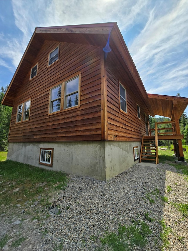 670GUSCREEK Gus Creek Rd, Yaak, MT 59935 - view of side of home featuring a wooden deck and stairway