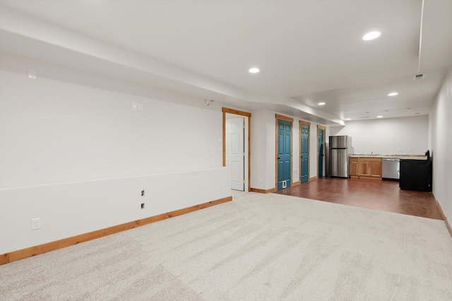 54 Bluebird Dr, Kalispell, MT 59901 - unfurnished living room with dark colored carpet and recessed lighting
