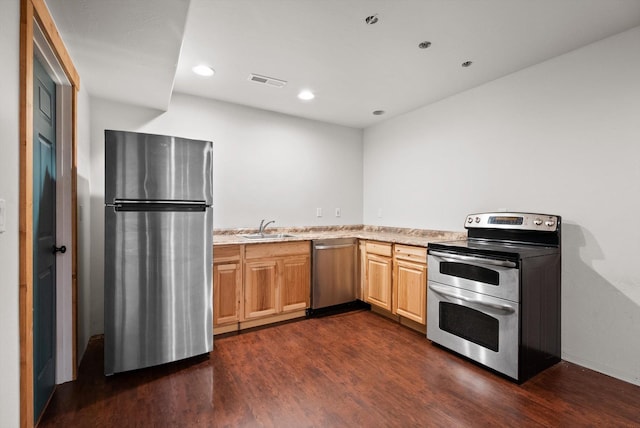 54 Bluebird Dr, Kalispell, MT 59901 - kitchen with stainless steel appliances, dark wood-type flooring, recessed lighting, and light brown cabinetry