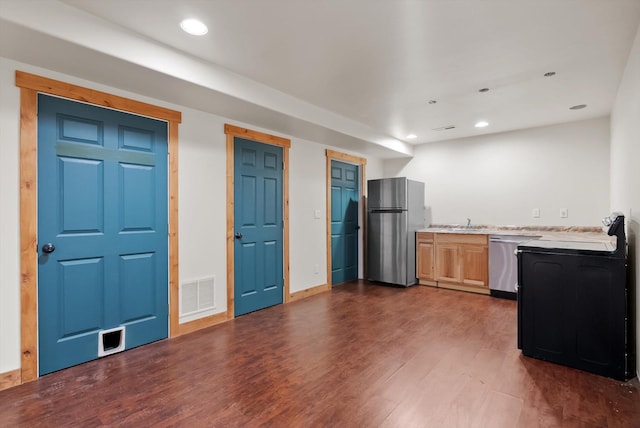 54 Bluebird Dr, Kalispell, MT 59901 - kitchen with stainless steel appliances, dark wood finished floors, light countertops, and recessed lighting