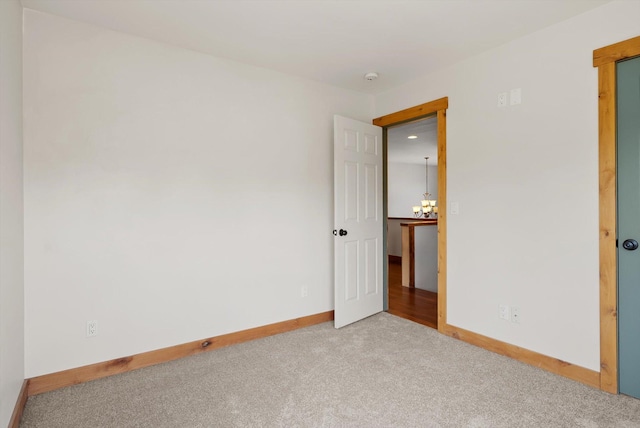 54 Bluebird Dr, Kalispell, MT 59901 - carpeted spare room featuring a chandelier and baseboards