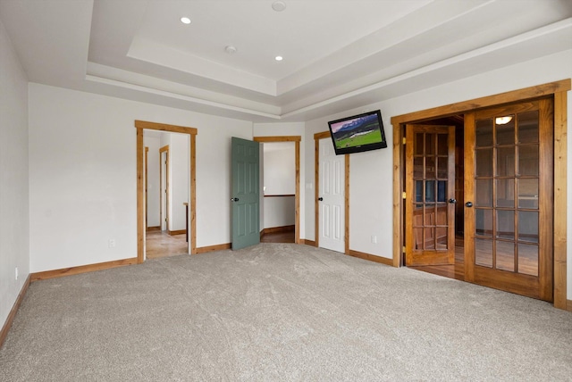 54 Bluebird Dr, Kalispell, MT 59901 - unfurnished bedroom featuring carpet floors, a raised ceiling, french doors, and recessed lighting