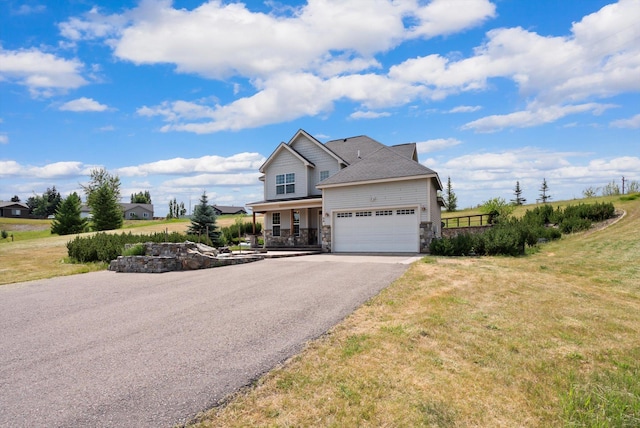 54 Bluebird Dr, Kalispell, MT 59901 - traditional-style home with stone siding, a porch, asphalt driveway, and a front yard