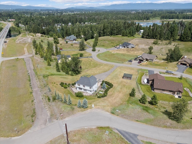 54 Bluebird Dr, Kalispell, MT 59901 - aerial view of property's location with a heavily wooded area and a nearby body of water