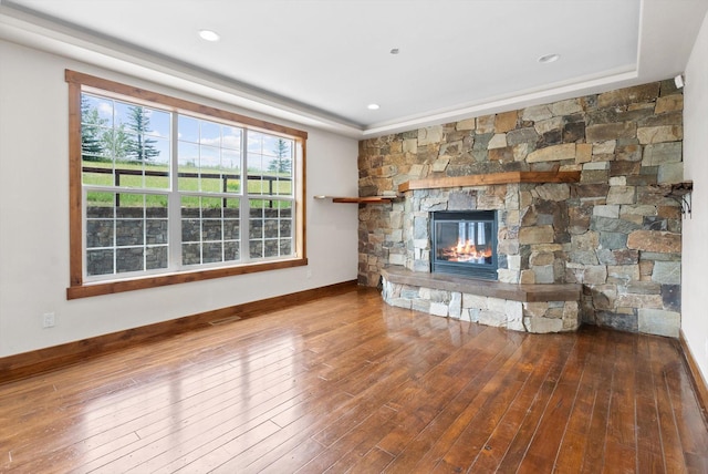 54 Bluebird Dr, Kalispell, MT 59901 - unfurnished living room featuring a fireplace and wood finished floors