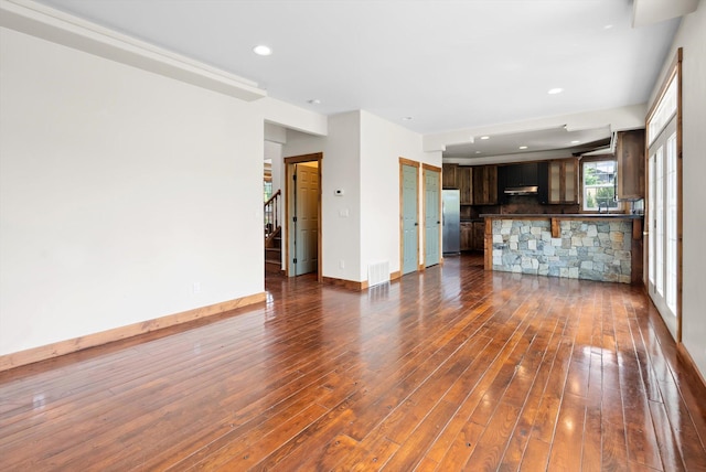 54 Bluebird Dr, Kalispell, MT 59901 - unfurnished living room with dark wood-style floors and recessed lighting