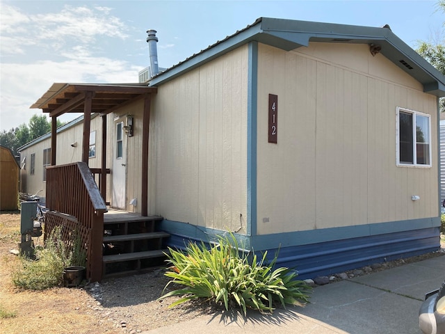 412 N Surrey St, Missoula, MT 59808 - view of property exterior with a metal roof