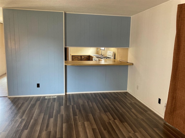 412 N Surrey St, Missoula, MT 59808 - unfurnished living room with baseboards and wood finished floors