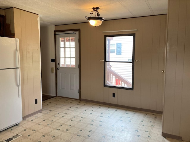 412 N Surrey St, Missoula, MT 59808 - unfurnished dining area featuring light flooring and baseboards
