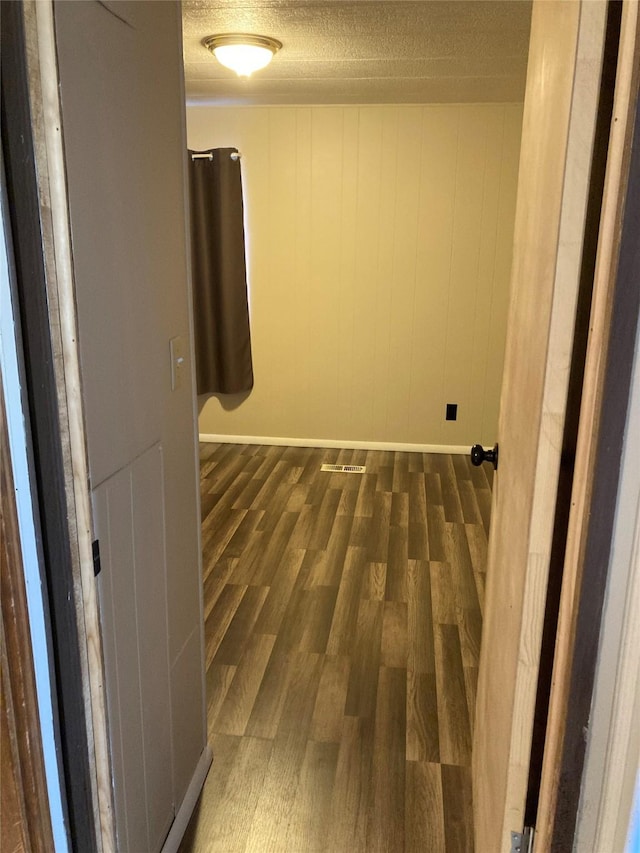 412 N Surrey St, Missoula, MT 59808 - hall featuring wood finished floors and a textured ceiling