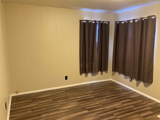 412 N Surrey St, Missoula, MT 59808 - unfurnished room featuring dark wood-style flooring and baseboards