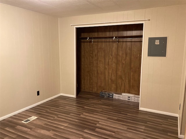 412 N Surrey St, Missoula, MT 59808 - unfurnished room with electric panel and dark wood-style flooring