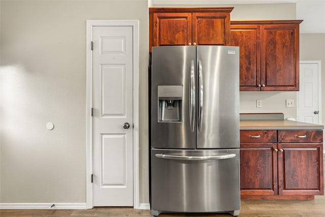 603 Luella Ln, Missoula, MT 59801 - kitchen with stainless steel refrigerator with ice dispenser, light wood-type flooring, and light countertops