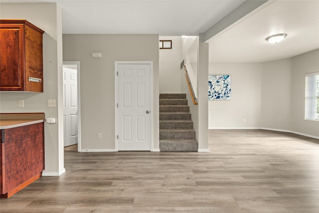 603 Luella Ln, Missoula, MT 59801 - unfurnished living room with stairway and light wood-style floors