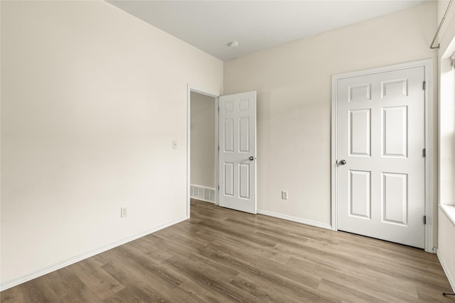 603 Luella Ln, Missoula, MT 59801 - unfurnished bedroom with wood finished floors and baseboards